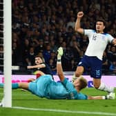 England defender Harry Maguire watches the ball roll in the back of his own net vs Scotland.