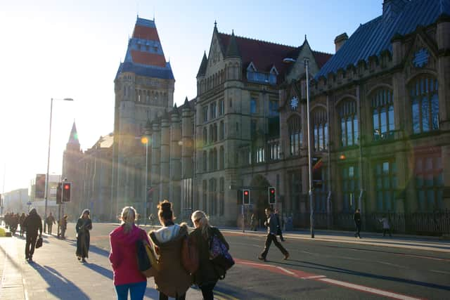 Students walk down Oxford Road outside the University of Manchester. Credit: University of Manchester