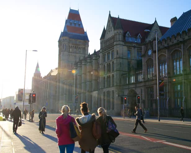 Students walk down Oxford Road outside the University of Manchester. Credit: University of Manchester