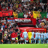 Man Utd fans raise banners in protest of the Glazers.