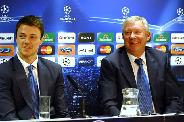 Sir Alex Ferguson and Jonny Evans during a Manchester United press conference in 2010 (Photo: PAUL ELLIS/AFP via Getty Images)