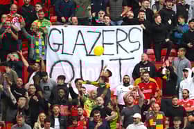 Man Utd fans hold up a ‘Glazers out’ sign at Old Trafford 