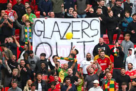 Man Utd fans hold up a ‘Glazers out’ sign at Old Trafford 