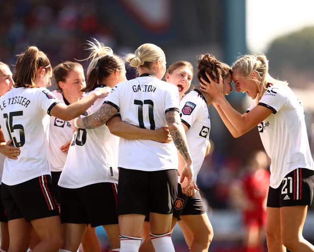 Lucia Garcia of Manchester United celebrates with Millie Turner after scoring her sides first goal during the FA Women's Super League match between Liverpool and Manchester United at Prenton Park on May 27, 2023 in Birkenhead, England. (Photo by Naomi Baker/Getty Images)