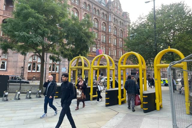 Large yellow bollards installed to help police control the flow of expected protesters.