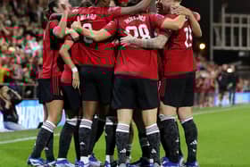 Manchester United players celebrate Melvine Malard's 80th minute strike. Cr. Getty Images.