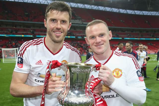 Wayne Rooney and Michael Carrick celebrate Manchester United's 2016 FA Cup win 
