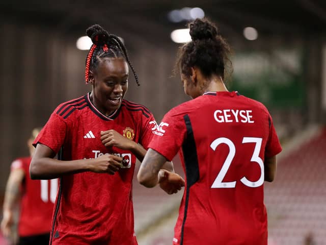 Melvine Malard celebrates her equaliser against Paris Saint-Germain with Geyse. Cr. Getty Images