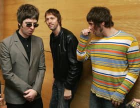  Noel Gallagher (L) Andy Bell (C) Liam Gallagher, members of the British rock band "Oasis" hold a photocall in Hong Kong 25 February 2006.