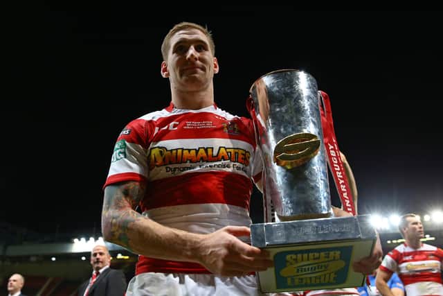 Sam Tomkins celebrates winning the Grand Final with Wigan back in 2013