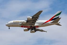 An Emirates Airlines Airbus A380 aircraft descends on its landing approach to Dubai International Airport in Dubai on April 17, 2023. (Photo by Giuseppe CACACE / AFP) (Photo by GIUSEPPE CACACE/AFP via Getty Images)