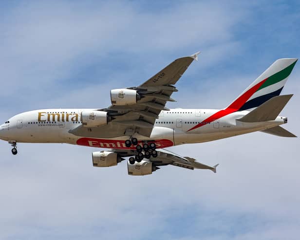 An Emirates Airlines Airbus A380 aircraft descends on its landing approach to Dubai International Airport in Dubai on April 17, 2023. (Photo by Giuseppe CACACE / AFP) (Photo by GIUSEPPE CACACE/AFP via Getty Images)