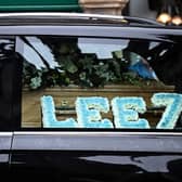 A flower tribute in Francis Lee’s hearse in his City blue 