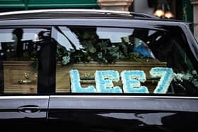 A flower tribute in Francis Lee’s hearse in his City blue 