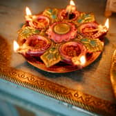 Diwali is the Hindu festival of lights. Photo by Yan Krukau: https://www.pexels.com/photo/food-wood-light-holiday-8819159/