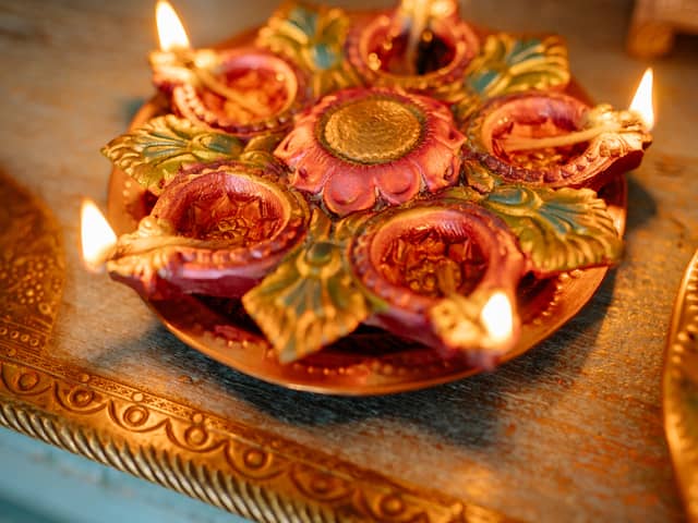 Diwali is the Hindu festival of lights. Photo by Yan Krukau: https://www.pexels.com/photo/food-wood-light-holiday-8819159/