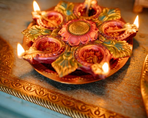 Diwali is the Hindu festival of lights. Photo by Yan Krukau: https://www.pexels.com/photo/food-wood-light-holiday-8819159/
