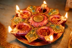 Diwali is the Hindu festival of lights. Photo by Yan Krukau: https://www.pexels.com/photo/food-wood-light-holiday-8819159/