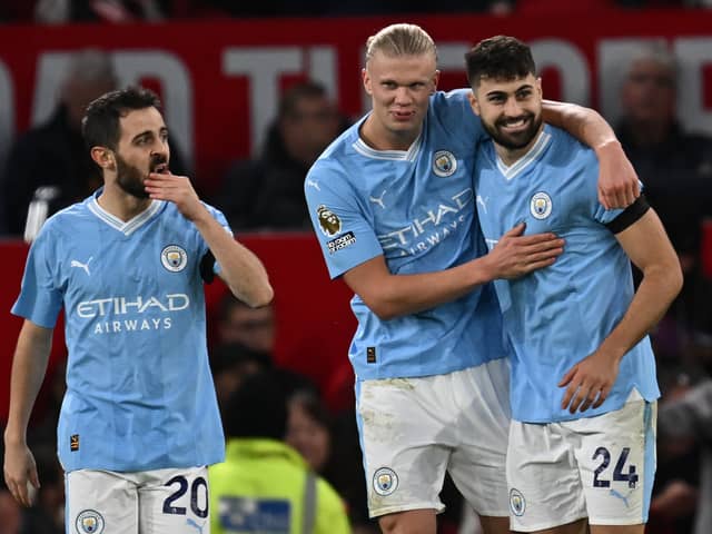 Erling Haaland celebrating scoring his and Man City's second goal at Old Trafford