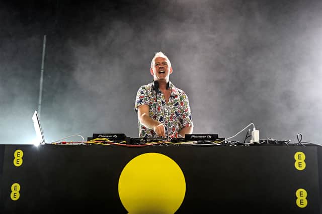  Fatboy Slim and virtual backing dancers from across the UK light up the sky above Alexandra Palace, to form the world's biggest holographic performance for the launch of the new EE, on October 19, 2023 in London, England. (Photo by Samir Hussein/Getty Images for EE)