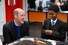 Prince William shares a joke with a youngster at the Hideaway Youth Project