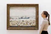  L.S. Lowry’s Beach Scene, Lancashire (estimated £1,000,000 – 1,500,000) goes on view at Sotheby's on November 17, 2023 in London, England.  (Photo by Tristan Fewings/Getty Images for Sotheby's)