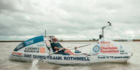 Frank Rothwell in his boat (Photo: Alzheimer's Research UK)