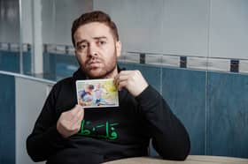 Dalloul Al-Neder, 31, holds a picture of his brother, who was killed in an Israeli airstrike in Gaza. Picture: SWNS 