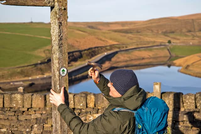 The roundels being fitted on the route