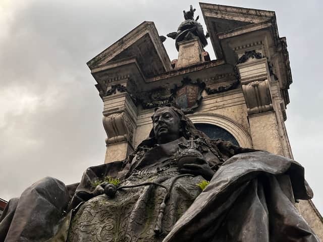 A version of Manchester's coat of arms above the Queen Victoria statue in Piccadilly Gardens. 