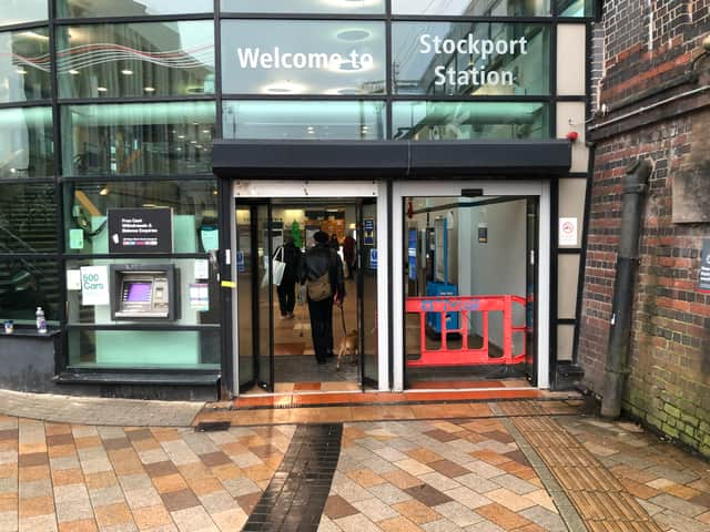 A broken door at the entrance to Stockport station