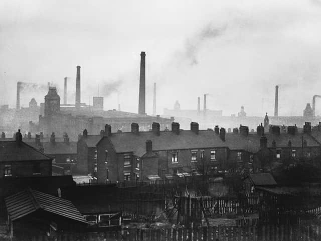 Cotton mill chimneys belching smoke in Manchester. (Photo by Fox Photos/Getty Images)