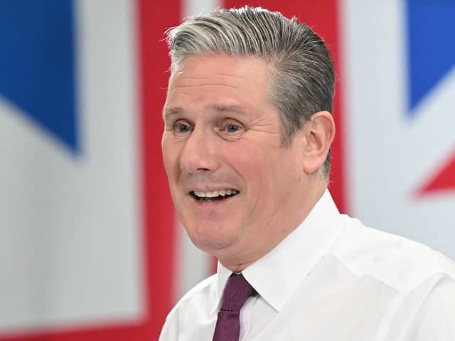 Britain's main opposition Labour Party leader Keir Starmer smiles as he delivers a speech at the National Composites Centre at the Bristol and Bath Science Park in Bristol, south-west England on January 4,