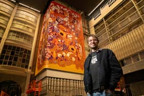 Alex Sylt, artist, pictured with his work at the Printworks.. Picture Jason Lock Photography