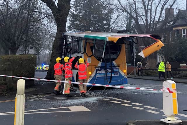 Fire crews work on the crashed bus in Chorlton on Friday morning