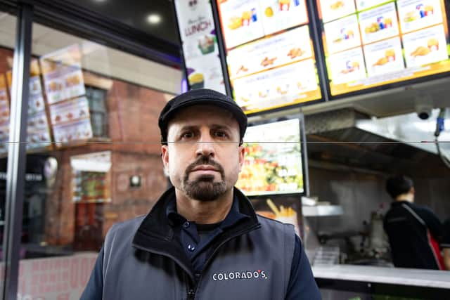 Amanj Ali, 41, at his chicken shop business Colorado's in Bury. Picture: SWNS 