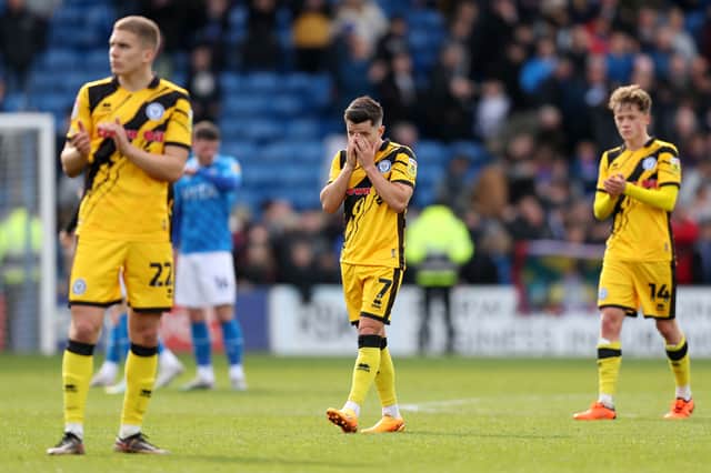 Rochdale's players react to their relegation to the National League last April. 