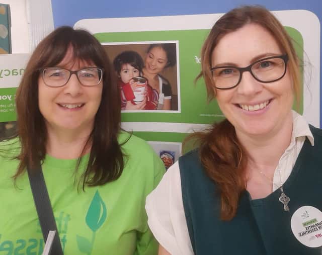 Kathryn Lamport (right) with a food bank volunteer