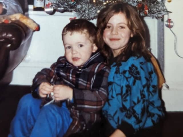 My cousin visiting us at the house in Preston Street at Christmas - he's well wrapped up. I'm the girl in the blue jumper