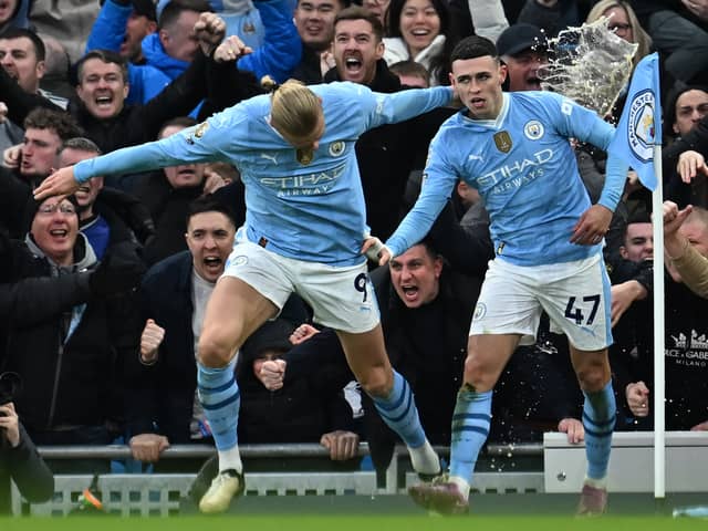 Erling Haaland congratulates Phil Foden on his fine Manchester derby goal
