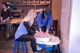 Reporter Emma Higgins tries out pottery. 