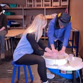 Reporter Emma Higgins tries out pottery. 