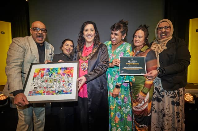 Lord Mayor of Manchester, Cllr Yasmine Dar (third left) congratulates Rainbow Surprise on their Pride of Manchester Award. Credit: Manchester City Council