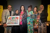 Lord Mayor of Manchester, Cllr Yasmine Dar (third left) congratulates Rainbow Surprise on their Pride of Manchester Award. Credit: Manchester City Council