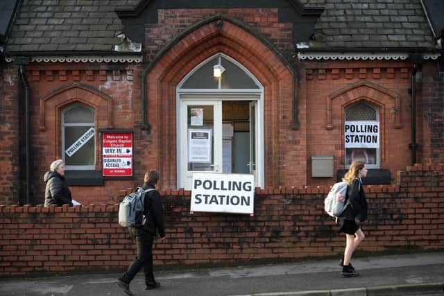Voters going to the polls in Rochdale 