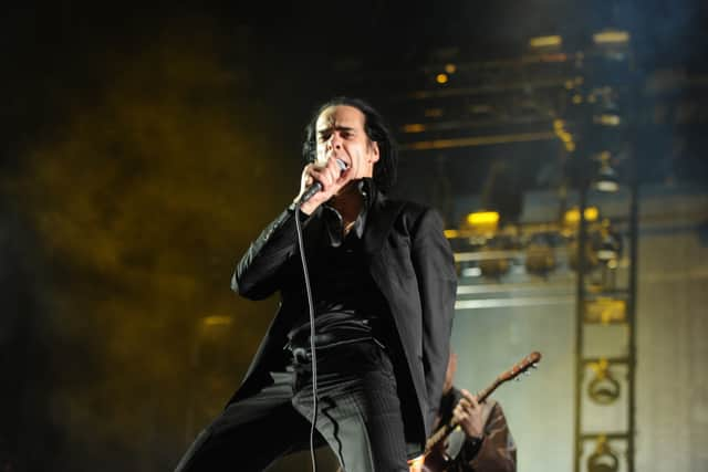 Musician Nick Cave of the band Nick Cave and the Bad Seeds perform onstage during day 3 of the 2013 Coachella Valley Music & Arts Festival