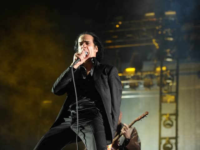 Musician Nick Cave of the band Nick Cave and the Bad Seeds perform onstage during day 3 of the 2013 Coachella Valley Music & Arts Festival