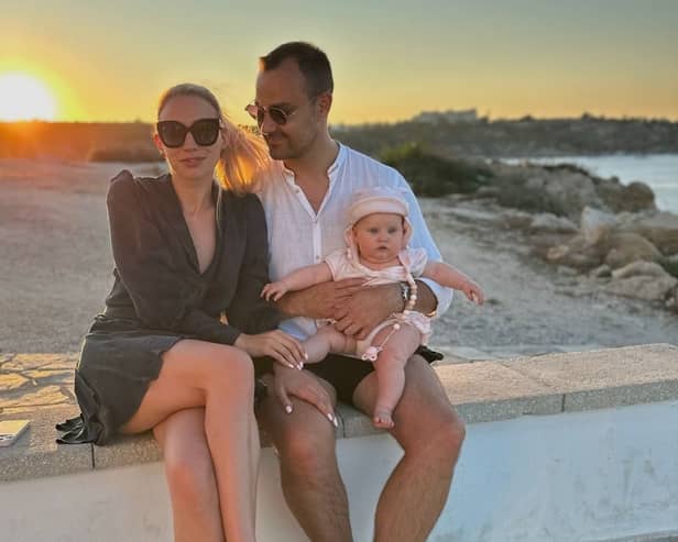 Elizabeth Kenina, 30, with husband Alex, 33, and baby Michelle, eight months, in Mallorca, Spain