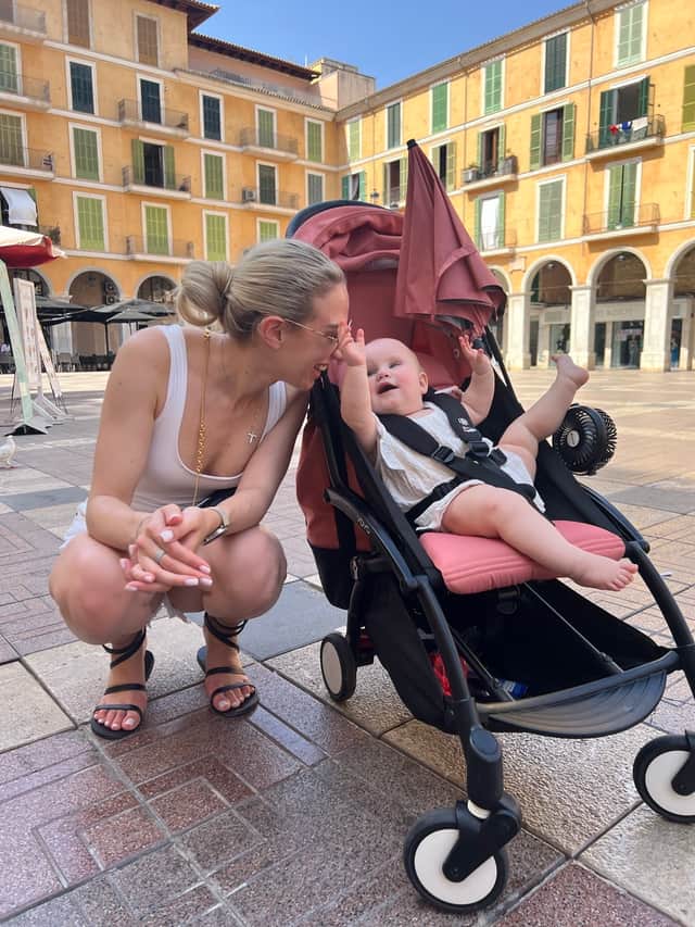 Elizabeth Kenina, 30, and baby Michelle, eight months, in Mallorca. 