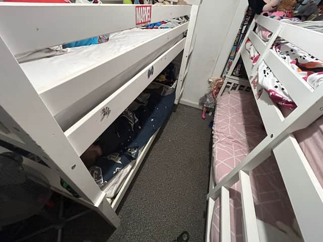 Bunk beds in the cramped home of Matthew Brooks and his partner Paige Deloughrey